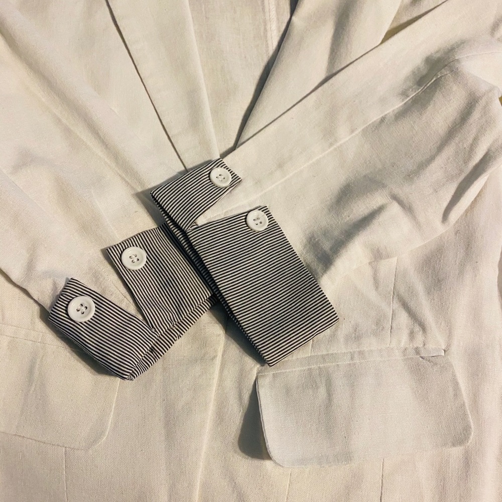 White jacket with pinstriped cuffed sleeves